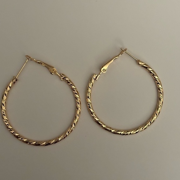 Twisted Wavy Gold Toned Hoop Earrings - Picture 2 of 3